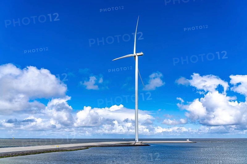 Strekdammen Wind Farm, wind farm at the seaport of Eemshaven in the Netherlands, built on offshore breakwaters, 2 GE Cypress 5, 5 MW turbines, with 158 metre blade diameter, together produce 11 MW of power, can supply 15, 500 households with electricity from wind, cumulus cloud over the North Sea, Netherlands