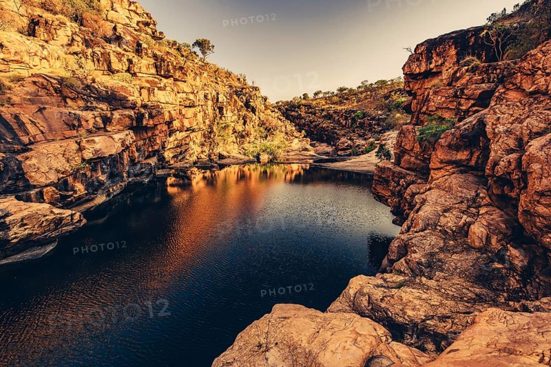 Bell Gorge waterfall, a body of water in north-west Australia in the Kimberley. Sunrise in the outback, Australia