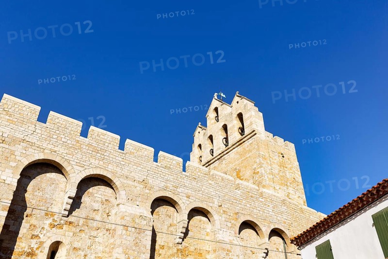 Church of Notre-Dame-de-la-Mer in front of a blue sky, Saintes-Maries-de-la-Mer, Camargue, France