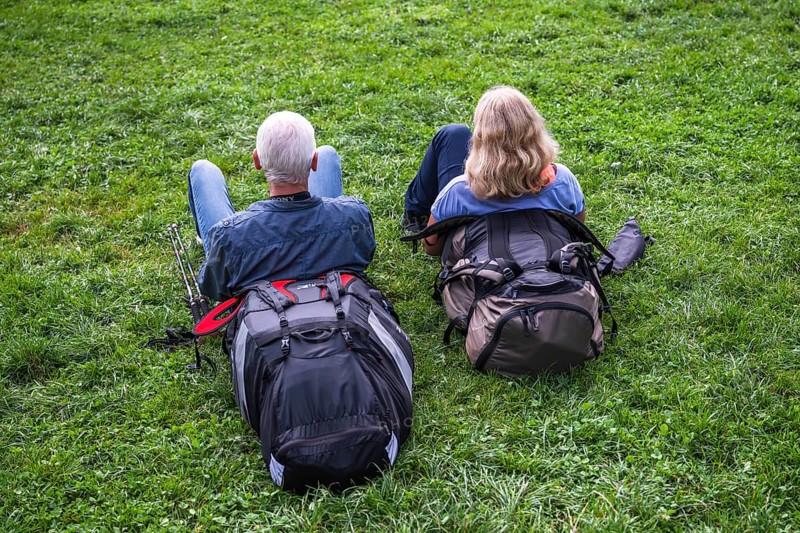Couple resting in the grass, Interlaken, Bern, Switzerland