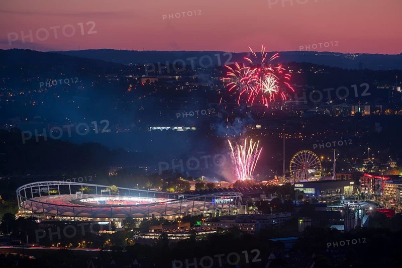 Fireworks at night illuminate the city above a stadium, next to an illuminated Ferris wheel in a hillside atmosphere, Spring Festival, MHP Arena, Bad Cannstatt, Stuttgart, Baden-Württemberg, Germany
