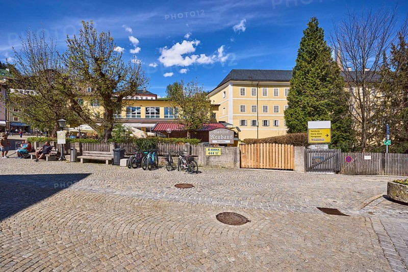 Gasthof Neuhaus, Royal Castle Berchtesgaden, pedestrian zone, square, cobblestones, benches, seated persons as secondary motif, bicycles, general architecture, blue sky, cumulus clouds, cirrostratus clouds, intersection Am Fischerbichl with market square, Berchtesgaden, Upper Bavaria, district Berchtesgadener Land, Bavaria, Germany
