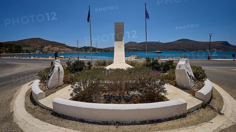War memorial, circular memorial with sea view, surrounded by two flags and a mountainous background, photos related to WW2, Battle of Leros, Lakki, Leros, Dodecanese, Greek Islands, Greece