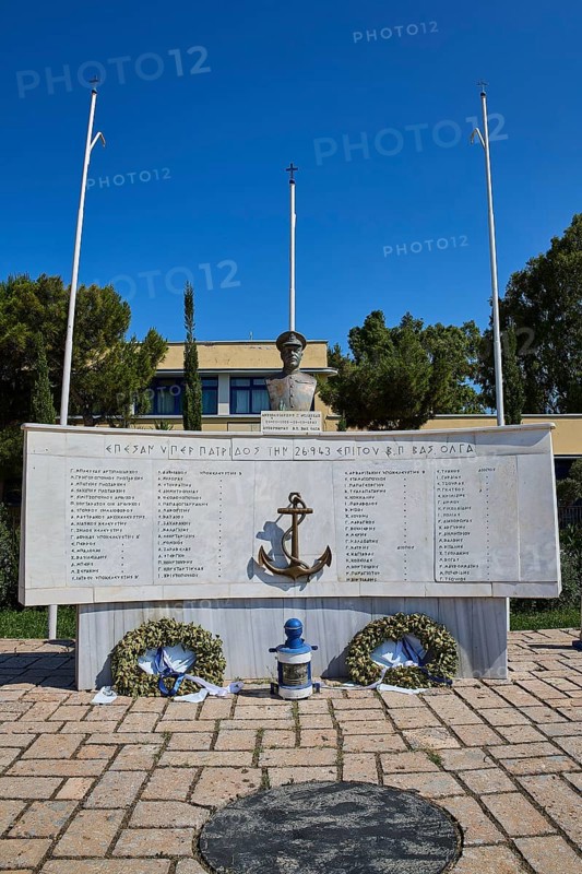 An open-air monument with bust and anchor, accompanied by plaques with inscriptions and wreaths, photos relating to WW2, Battle of Leros, Portolago, Lakki, Leros, Dodecanese, Greek Islands, Greece