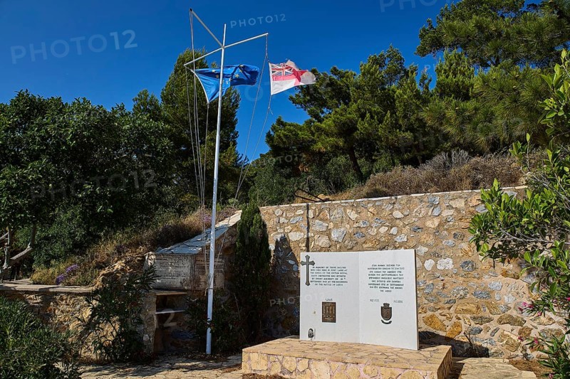 HMS Intrepid, British battleship, Greek battleship AT Olga, memorial with two flags and a plaque in front of a stone wall, photos related to WW2, Battle of Leros, Lakki, Leros, Dodecanese, Greek Islands, Greece