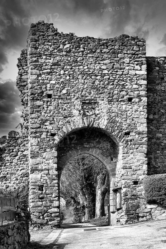 Léotoing village. An old stone archway showcases weathered stones and intricate designs, Haute Loire, Auvergne Rhone Alpes, France