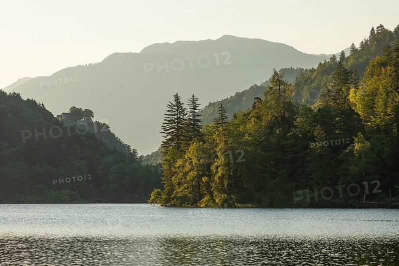 Sunrise in summer at Lake Thumsee near Bad Reichenhall. With a view of the Karlstein castle ruins