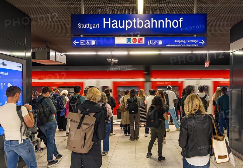 Stuttgart main station with S-Bahn. People on the platform waiting for their train. Stuttgart, Baden-Württemberg, Germany