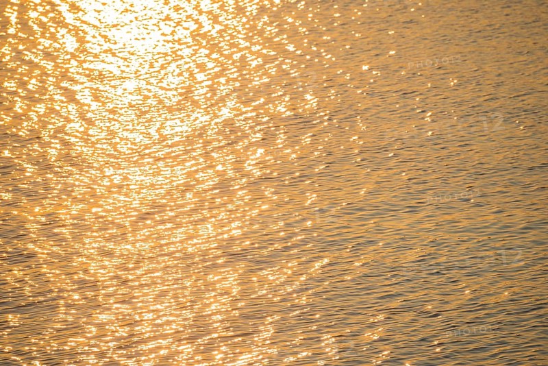 Golden sunlight is reflected by the water surface of the North Sea, natural glow, glow, highlights on small waves, reflection, light reflection, evening light, sunset, atmosphere, atmospheric, illuminated, bright, waters, no people, light, light reflections, light reflection, light reflection, deserted, nobody, reflection, mirror, reflection, mood, atmospheric, harbour, island dune, Heligoland, Schleswig-Holstein, North Sea, Germany