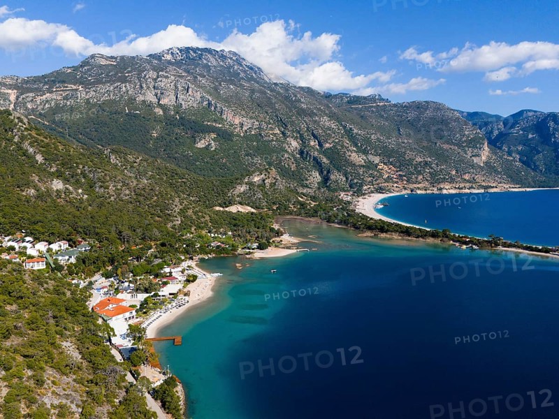 A picturesque coastal landscape with blue sea, beach and majestic mountains, Fethiye, Mugla, Mugla, Aegean, Turkey