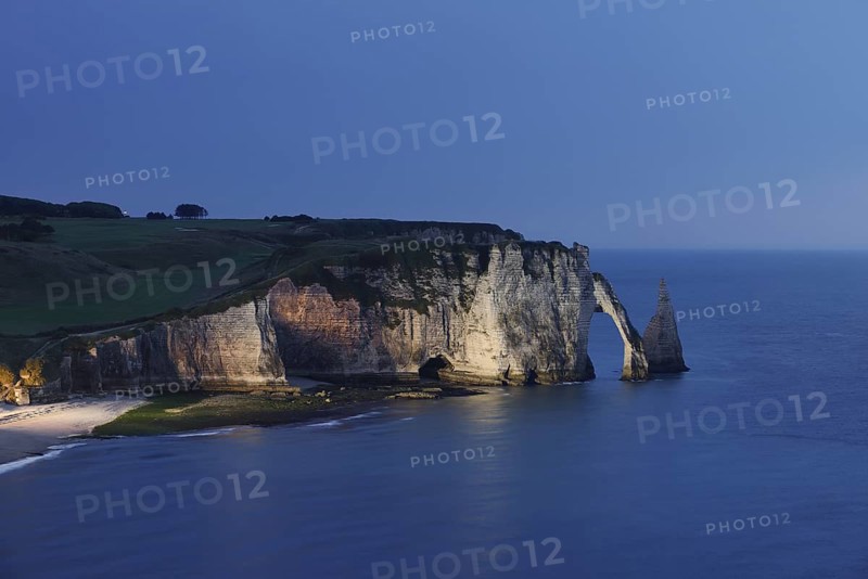 Cliffs with the Falaise d'Aval rock gate and the Aiguille d'Etretat rock needle at night, Etretat, Alabaster Coast, Seine-Maritime, Normandy, France