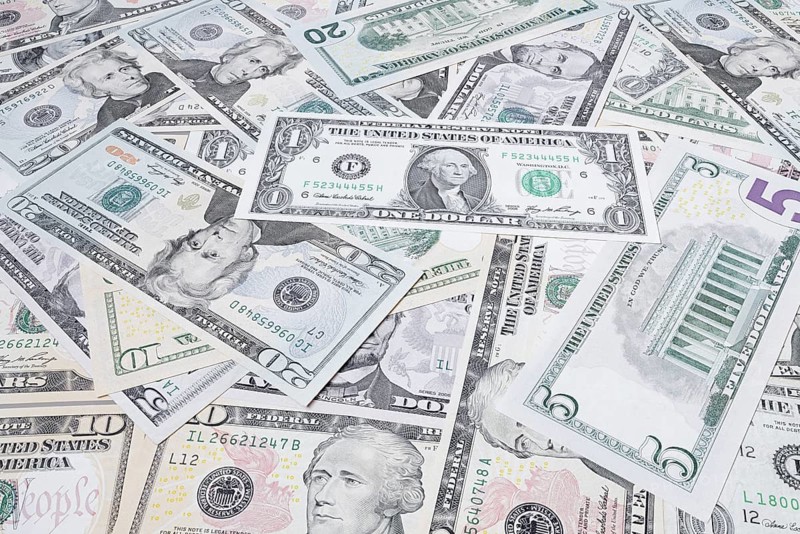 Various US dollar notes in a pile, banknotes