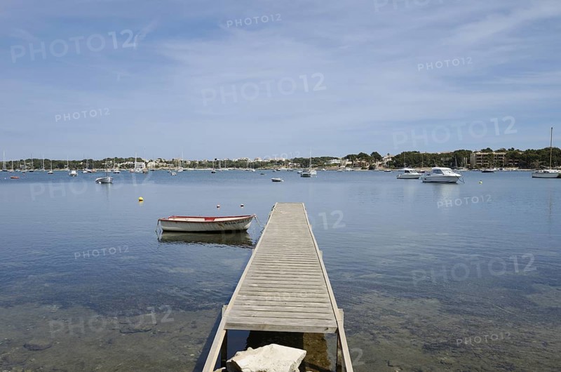 Wooden jetty and boats in the harbour, Porto Colom, Majorca, Balearic Islands, Spain