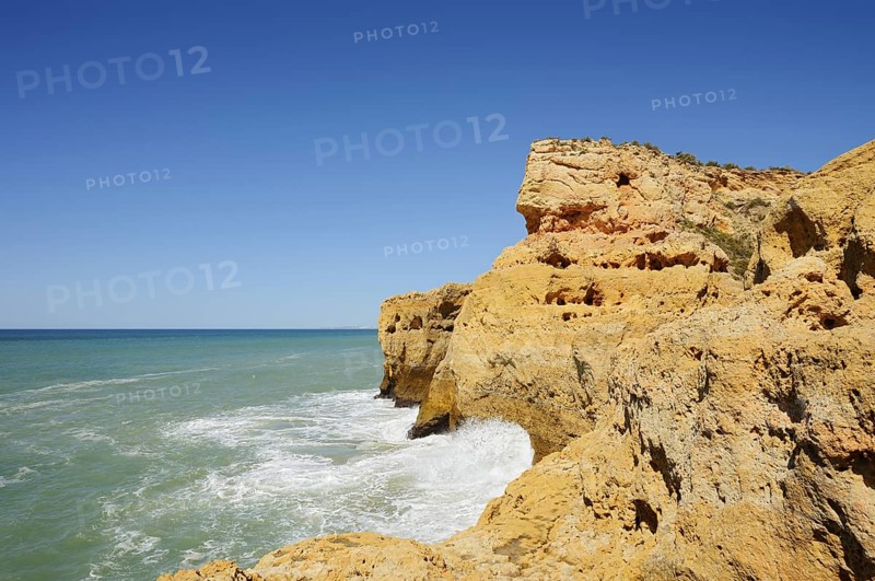 Surf on the rocky coast, Carvoeiro, Algarve, Portugal