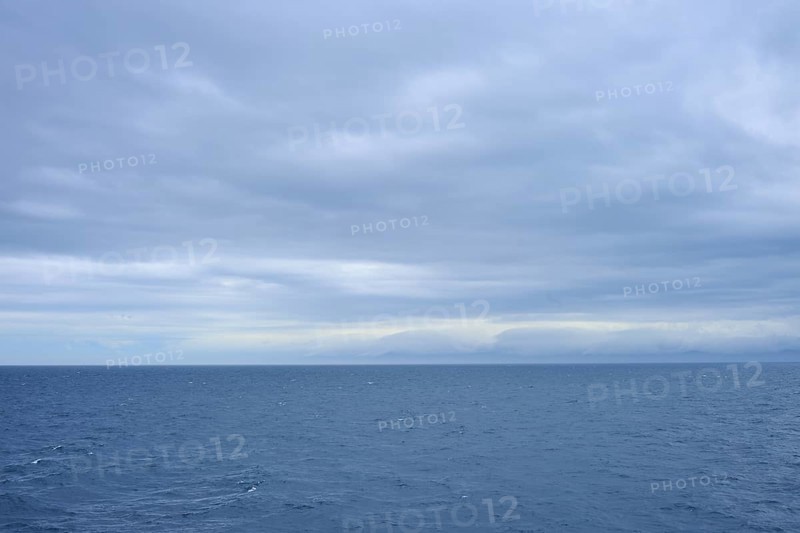 Vast sea under a cloudy sky with a view of distant horizons, summer, Cook Strait, North Island, South Island, New Zealand