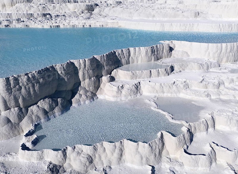 Natural limestone formations with turquoise-coloured water in several cascades. Structure appears geologically significant, aerial view, sinter terraces, limestone terraces, travertine terraces, Pamukkale, Denizli, UNESCO World Heritage Site, Anatolia, Turkey