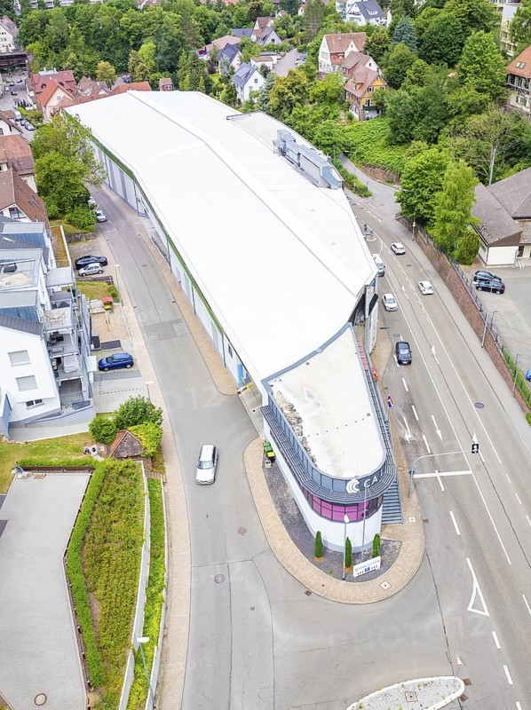 Aerial view of a modern building on a street corner in an urban environment, City Centre Calw, Germany