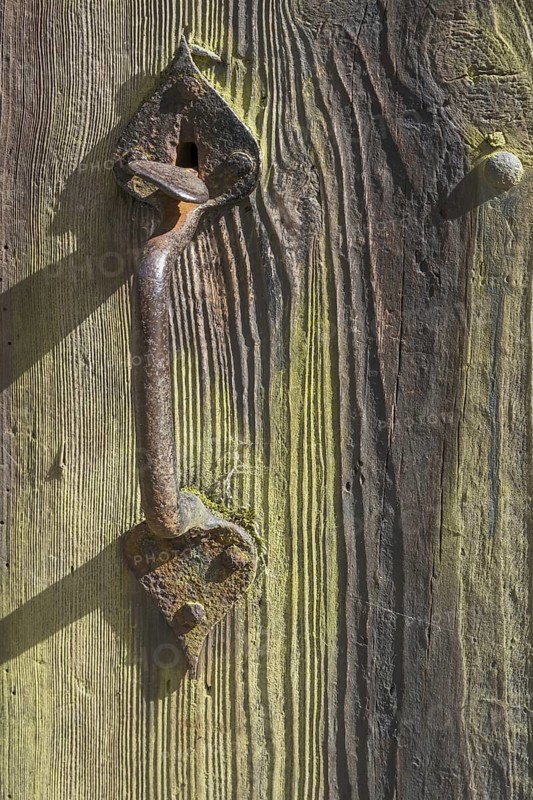 Old wooden door with iron fittings, Münsterland, North Rhine-Westphalia, Germany