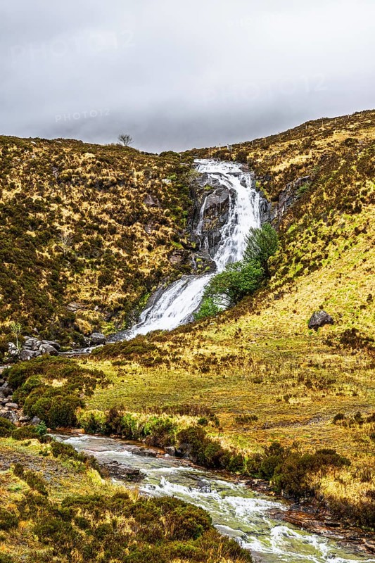 Eas a' Bhradain waterfall, Red Cuillin mountains, Loch Ainort, Isle of Skye, Scotland, UK