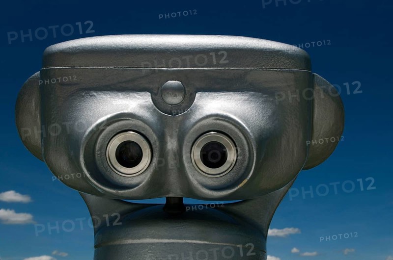Visitors can easily spot the coin-operated binoculars in Auvergne, France, inviting people to enjoy stunning landscapes and distant vistas on a cloudy day