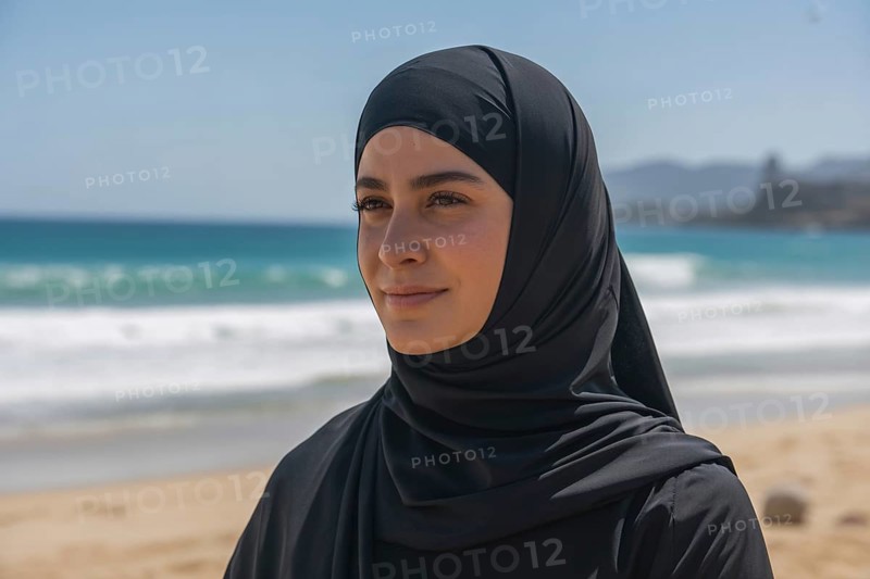 Close up of woman in black hijab at sunny beach. Generative ai, AI generated