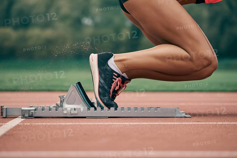 Close-up of female athlete in running shoes on starting block at running track. Concept of speed and competition. Generative ai, AI generated