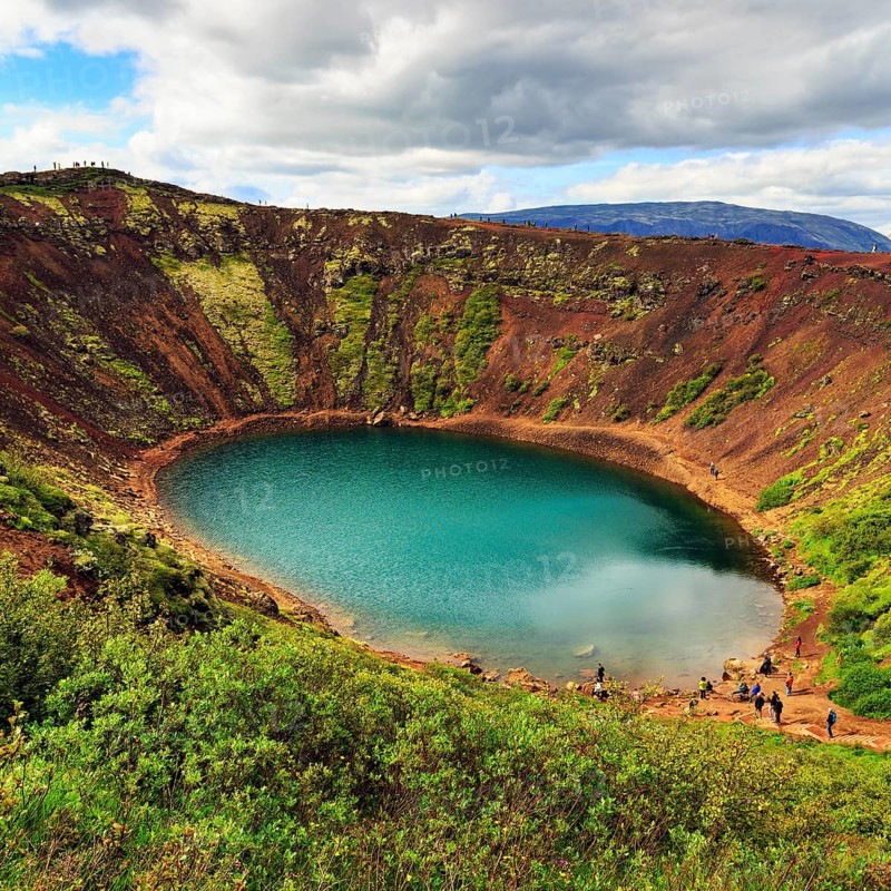 Hikers round Kerið, Kerid, crater lake with turquoise-green water, Golden Circle, ring road, Iceland