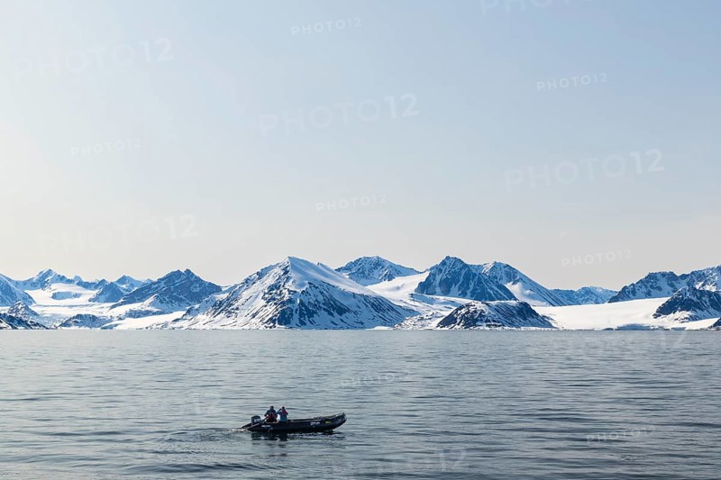 Zodiac in front of glacier, mountain range, snow, sea, Smeerenburg, Spitsbergen, Svalbard