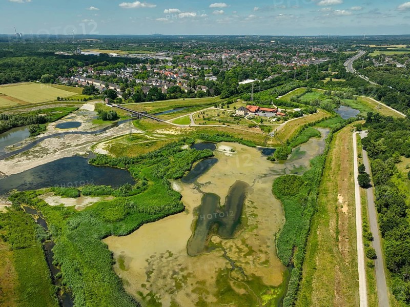 Dortmund, Castrop-Rauxel, North Rhine-Westphalia, Germany - River renaturalisation, renaturation of the Emscher, flood retention basin HRB Mengede. A new floodplain landscape is being created at the Emscher-Auen farm, expanding the area for flood protection during heavy rainfall and for biodiversity. The previously straightened Emscher is being given curves again and can meander through its new floodplain. Following the construction of a parallel sewer, the Emscher has been completely free of sewage since 2022. The river was previously an open, above-ground combined sewer with rainwater and wastewater