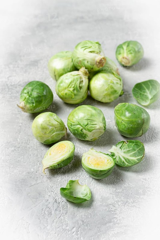 Fresh Brussels sprouts, raw, top view, on a gray table, no people