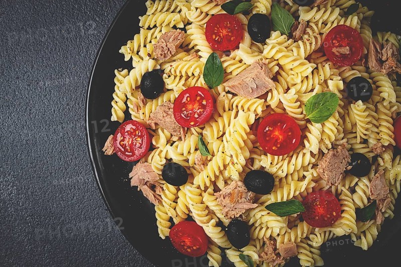 Tuna salad, fusilli pasta, olives and cherry, olive oil, homemade