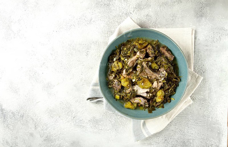 Chakapuli, Georgian dish, stewed meat with herbs and tkemali, in white wine, homemade, no people