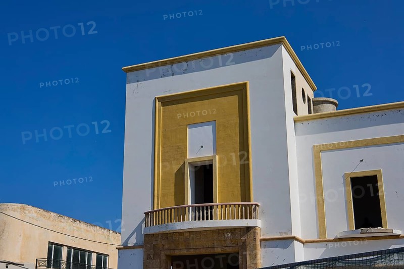 Modern building with geometric design and clear edges under a clear blue sky, Armando Bernabiti, Historicism, Rationalism, Art Deco, Rationalism, Rodolfo Petraco, Fascism, Portolago, Lakki, Leros, Dodecanese, Greek Islands, Greece