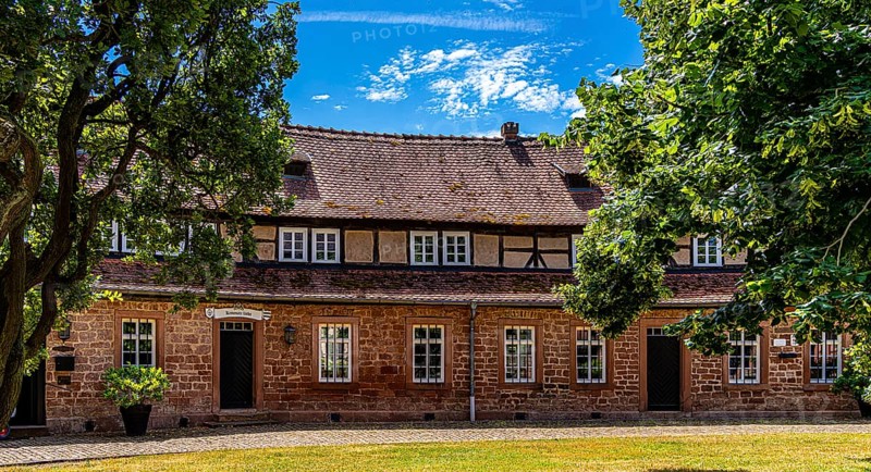 The old castle with Barbarossaplatz and the castle café in the old town centre of Büdingen, Hesse, Germany