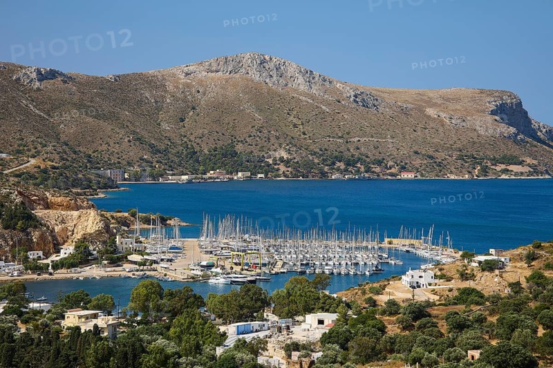 Panoramic view of a harbour full of sailing ships on a picturesque coastal landscape, Lakki, Leros, Dodecanese, Greek Islands, Greece