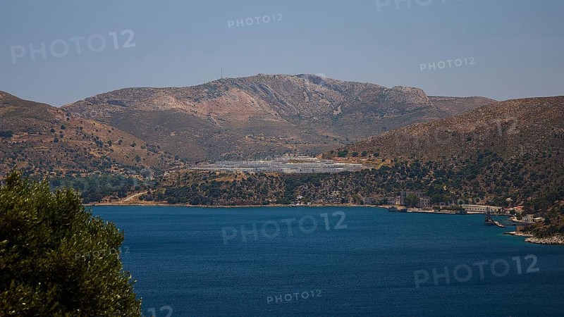 Landscape with mountains behind a blue sea under a clear blue sky, refugee shelter, Lakki, Leros, Dodecanese, Greek Islands, Greece