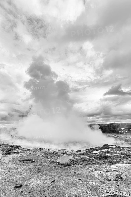 Active Strokkur, water column, high temperature area Haukadalur, tourist attraction at the Golden Circle, monochrome, Sudurland, Iceland