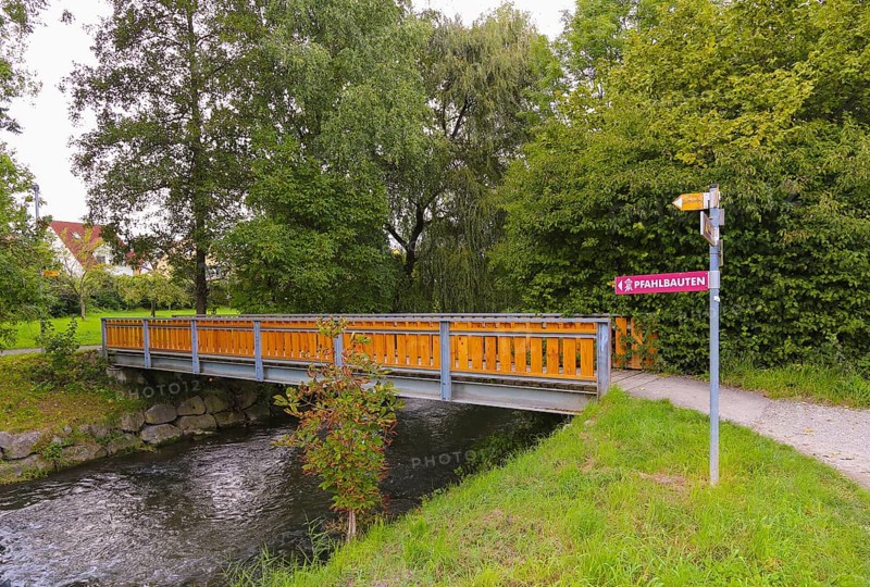 Sign, signpost, pile dwellings, writing, letters, bridge, watercourse, footpath, Oberuhldingen district, Uhldingen-Mühlhofen municipality, Lake Constance district, Baden-Württemberg, Germany