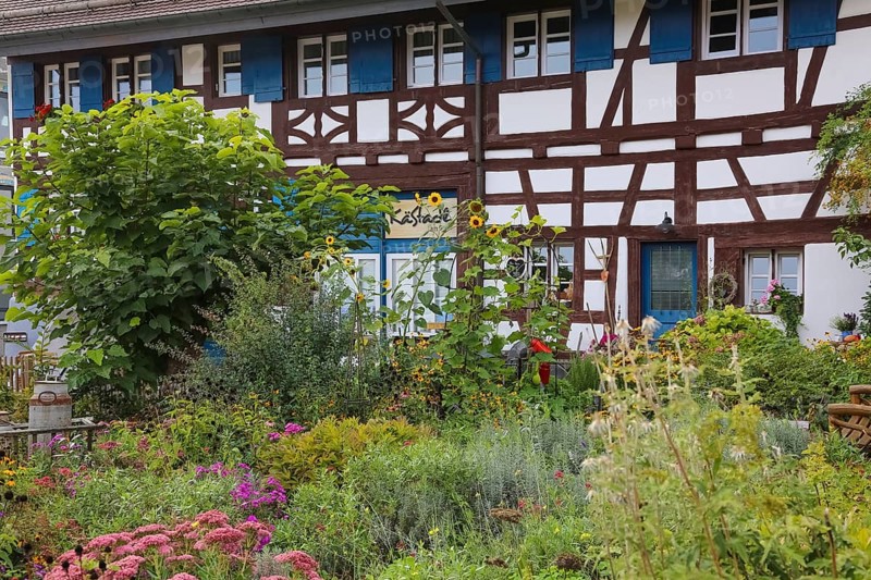 Kässtadel, KäStadel, on the lake, specialist cheese shop with bistro, cheese shop, delicatessen, café, regional cuisine, small restaurant, garden, idyll, still life, half-timbered house, blue wooden shutters, shutters, time out, stop off, Oberuhldingen district, Uhldingen-Mühlhofen municipality, Lake Constance district, Baden-Württemberg, Germany