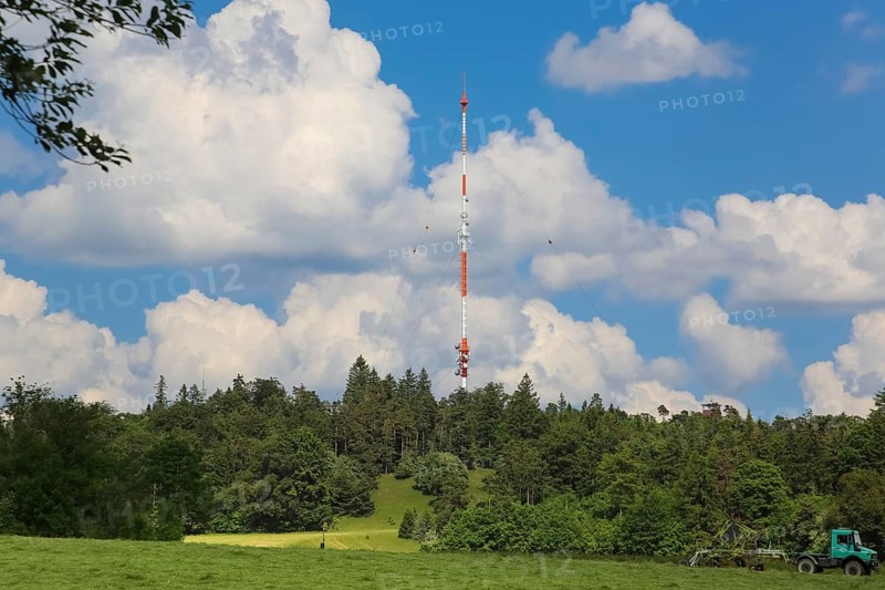 Raichberg transmitter, clouds, trees, basic network transmitter of the Südwestrundfunk for radio and television, antenna support 137 metres, tubular steel mast on the Raichberg, Onstmettingen district, Zollernalbkreis, Baden-Württemberg, Germany