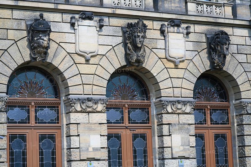 Police building, architectural detail, stained glass, arched window, sun motif, from left to right: police, judge and convict (path of justice?), Dresden, Germany