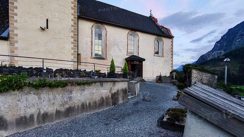 Late Gothic Catholic parish church of Saints George and Nicholas from around 1500 with churchyard, in Oetz im Ötztal, Tyrol, Austria, for editorial use only