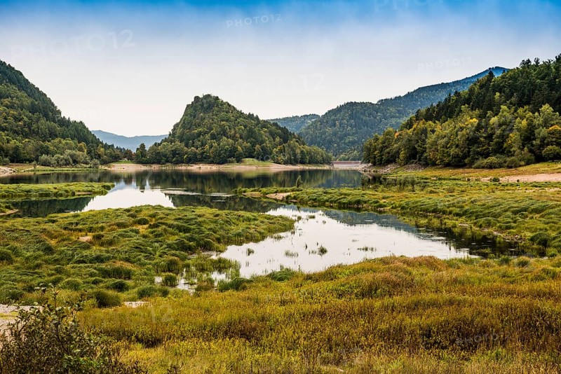 Picturesque mountain lake with water reflections in autumn, Lac de Kruth-Wildenstein, Kruth, Vosges, Alsace-Lorraine, Department of Vosges Haut-Rhin, France