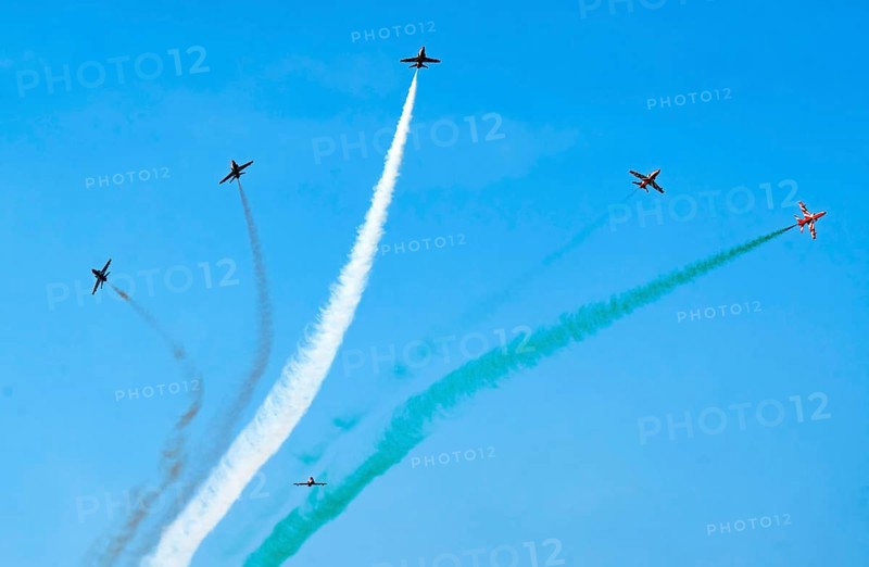 The Indian Air Force (IAF) Surya Kiran aerobatics team performs during an air show as part of the 93rd Air Force Day celebrations on November 8, 2025 in Guwahati, India