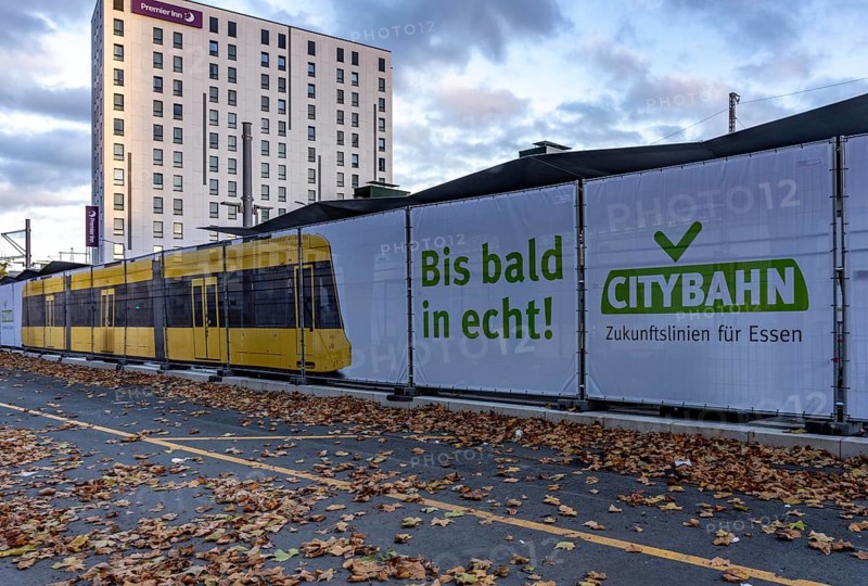 Construction site of the stop at the main train station, for the new city railway, visualization of the full-size tram, a new tram line over 5 km long, which will connect the west of Essen, the new district 51, with the city center, from 2026, Essen, North Rhine-Westphalia, Germany