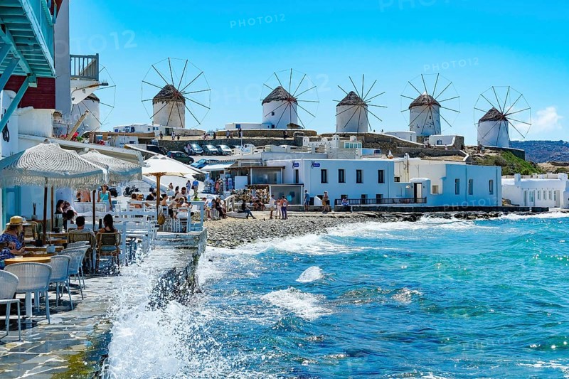 Mykonos, Cyclades, Greece - The six sixteenth-century windmills, lined up on a hill above Mykonos Town, Mykonos Chora, are the island's landmark. Mykonos is part of the Cyclades archipelago in the Aegean Sea