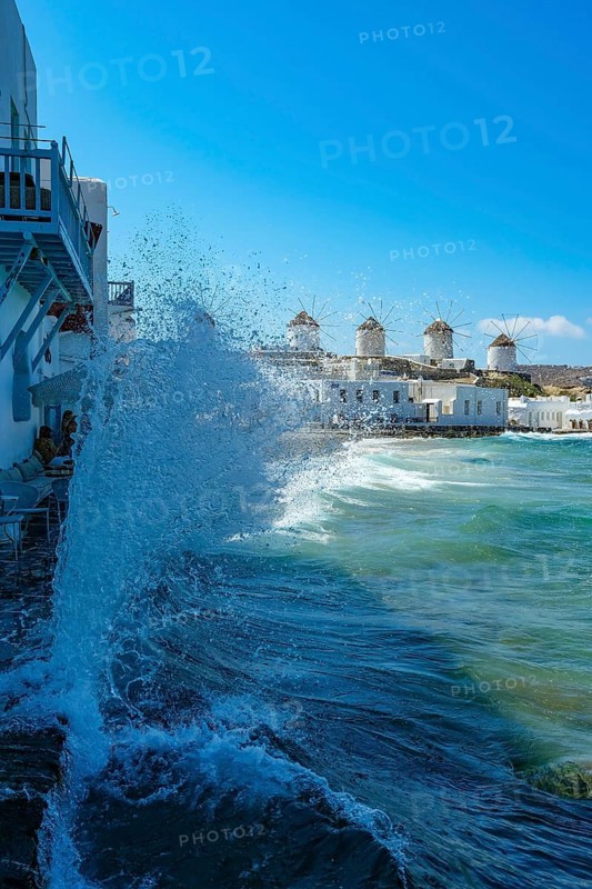 Mykonos, Cyclades, Greece - The six sixteenth-century windmills, lined up on a hill above Mykonos Town, Mykonos Chora, are the island's landmark. Mykonos is part of the Cyclades archipelago in the Aegean Sea