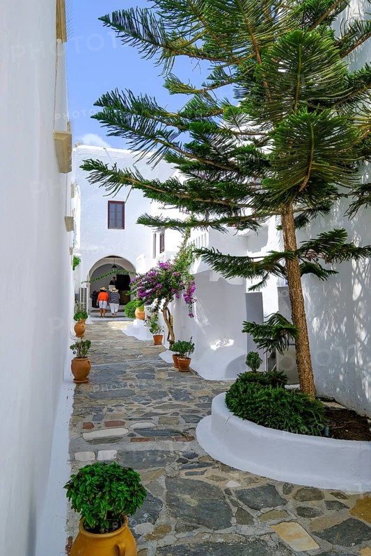 Ano Mera, Mykonos, Cyclades, Greece - The Panagia Tourliana monastery is the center of Ano Mera. The 16th century men's convent on the village square in the interior of the island is now a tourist attraction much visited by tourists