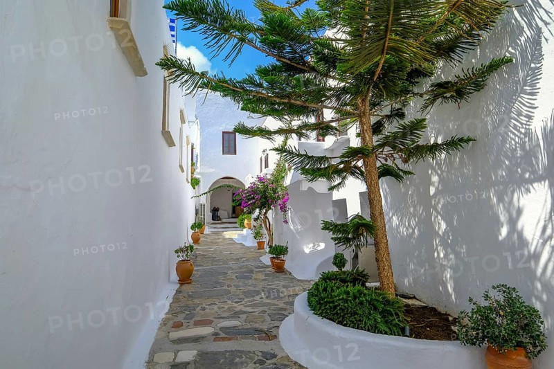 Ano Mera, Mykonos, Cyclades, Greece - The Panagia Tourliana monastery is the center of Ano Mera. The 16th century men's convent on the village square in the interior of the island is now a tourist attraction much visited by tourists