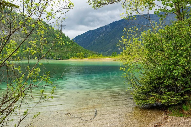 Landscape of Lake Offensee after rain when the sun comes through the clouds in spring, Salzkammergut, Austria